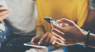 Image of a hand holding a cell phone